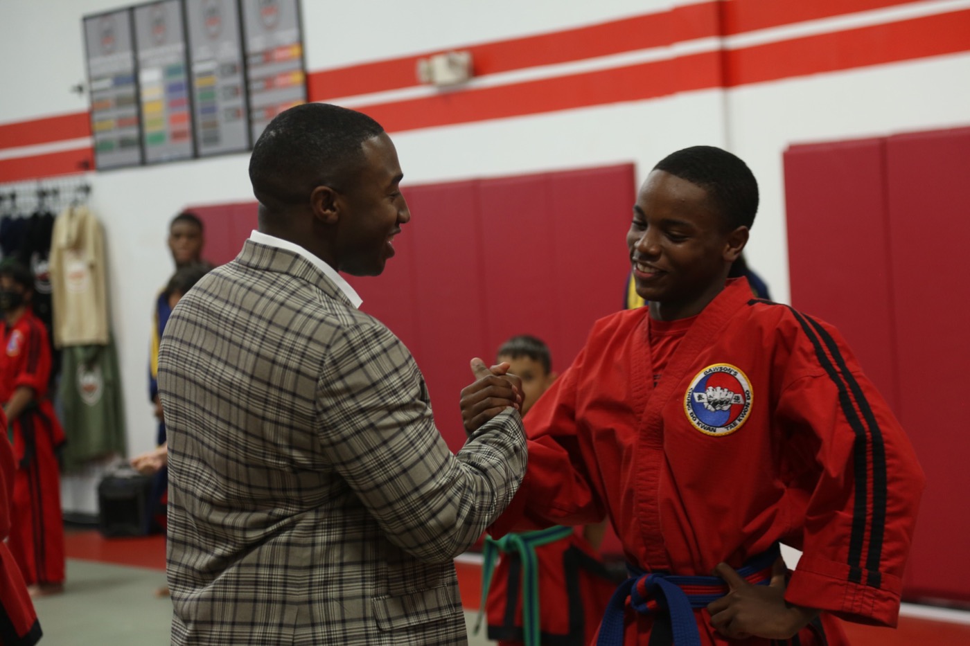 Kameren Ali congratulating a student at Maryland's Best Karate